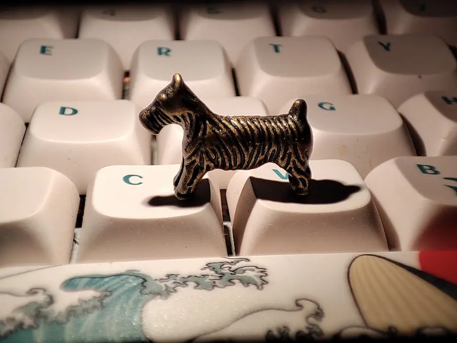 Scottie Dog token sitting on Keyboard
