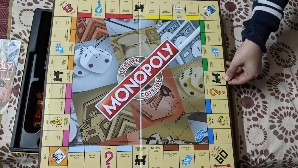 Monopoly Board Image Holding by hand