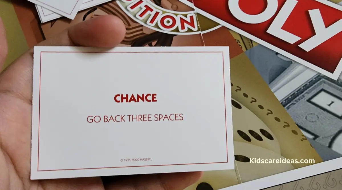 Image of Chance card which reads "Go Back 3 Spaces"