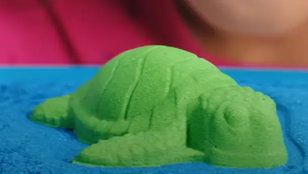 kinetic sand molded to turtle shape